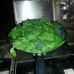Spinach being sauteed
